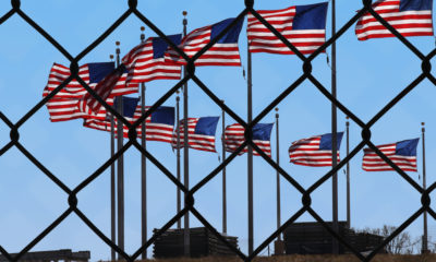 Picture of American flags at U.S.-Mexico border.