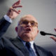 Photo of Rudy Giuliani speaking and making a point with both hands