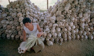 Photo of a man cleaning skulls