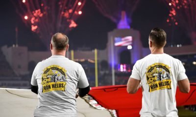 Photo of first responders holding the flag at the Los Angeles Rams game