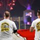 Photo of first responders holding the flag at the Los Angeles Rams game