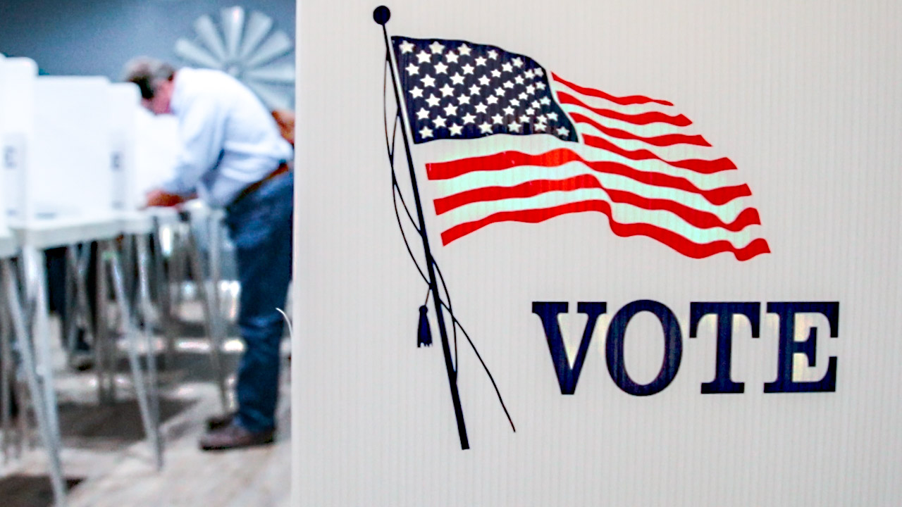 Voter casts a ballot at local precinct in Fresno County during 2018 General Election