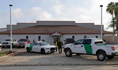 Photo of U.S. Border Patrol Agents walking near their vehicles