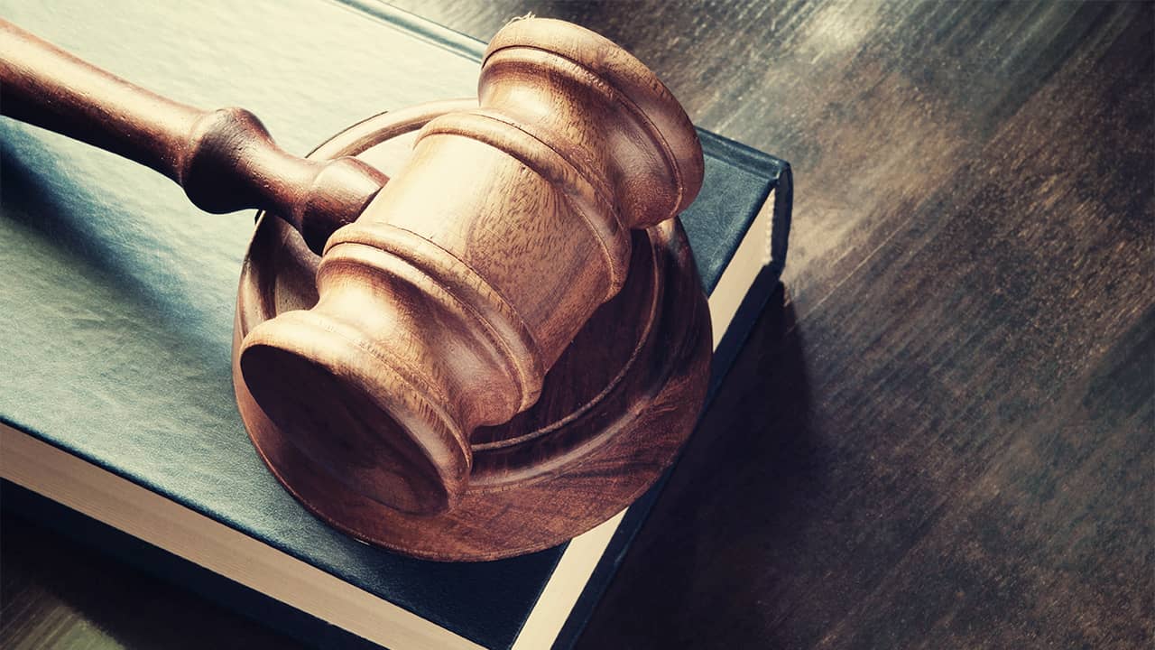 Photo of a judge's gavel and book