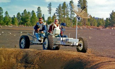 Photo of Apollo 15 astronauts, Jim Irwin and Dave Scott, driving a prototype of a lunar rover