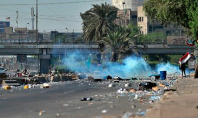 Photo of Iraqi security forces using tear gas