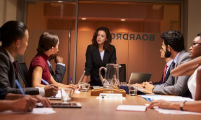 Photo of a women executive leading a board meeting