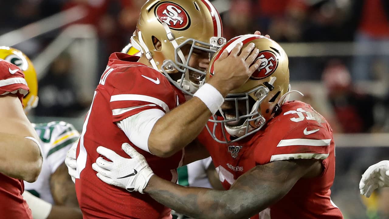 Photo of San Francisco 49ers running back Raheem Mostert and quarterback Jimmy Garoppolo