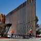 Photo of government contractors working on a section of the Pentagon-funded border wall