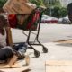 Photo of Will panhandling on the sidewalk