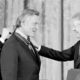 Photo of Jimmy Carter congratulating actor Kirk Douglas