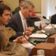 Photo of Rep. Josh Harder with a stuffed swamp rat at a congressional hearing