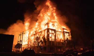 Photo of a housing complex on fire