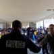 Photo of campus resource officer Martin saying goodbye to students at Cooper Academy in Fresno, Californiaooo