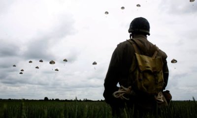 Photo of a man watching a parachute jump in France