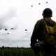 Photo of a man watching a parachute jump in France