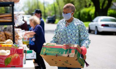 Image of people getting groceries at a food bank