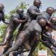 Photo of a statue of football players