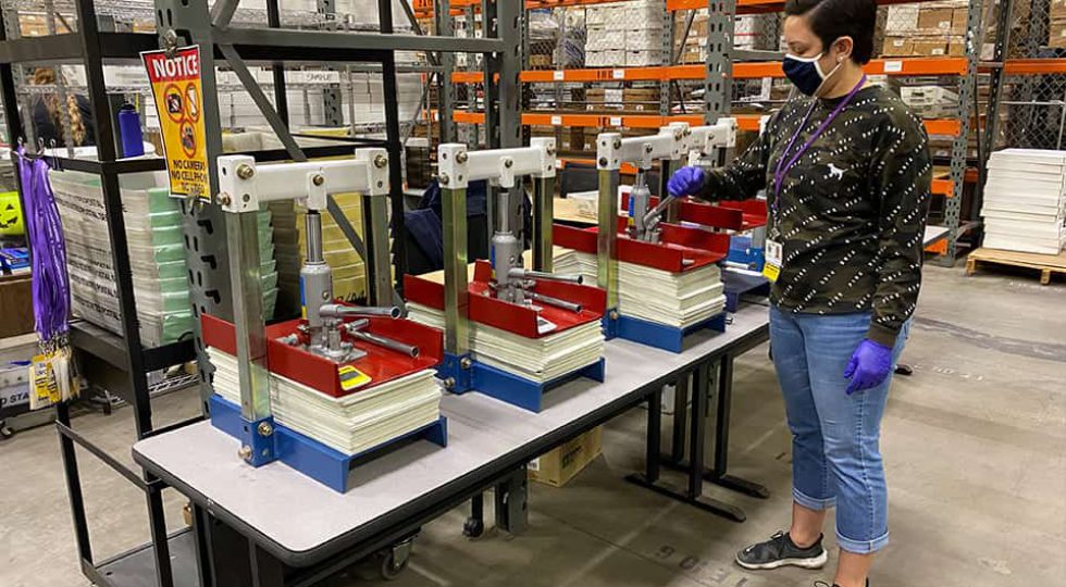 Vice-like machines then press the ballots to make sure they are flat. The process takes about 30 minutes. (GV Wire/David Taub)