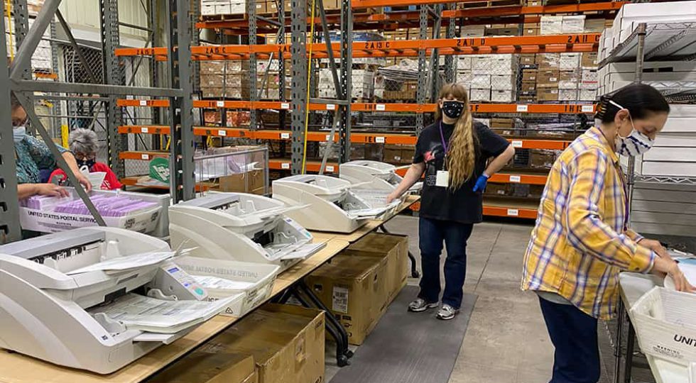 Ballots are sorted then boxed up, 250 at a time and receive a seal. (GV Wire/David Taub)