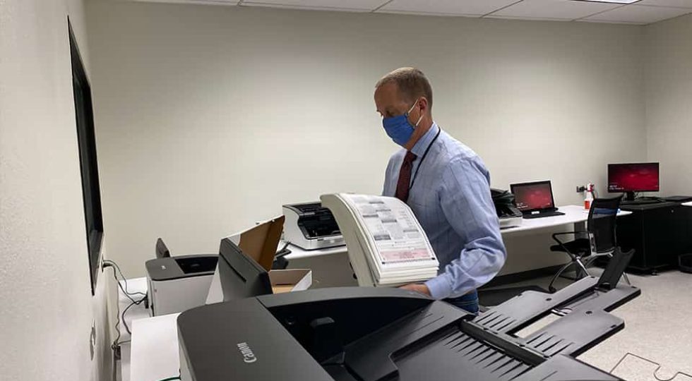 The boxes are taken to a secure room, opened, and placed in a scanning machine. Raymond Beye is one of five employees to have access to the room. (GV Wire/David Taub)